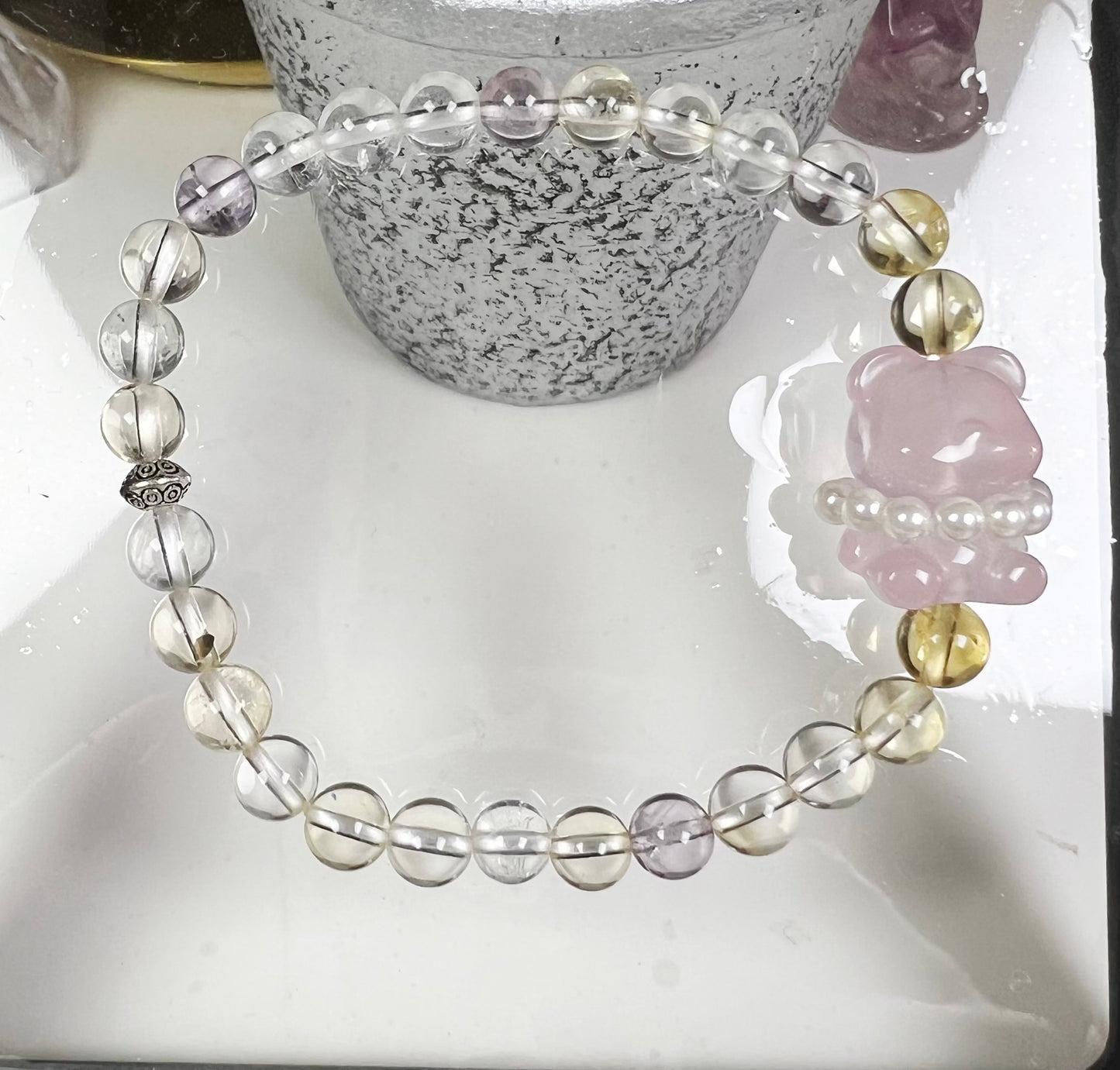 four-season crystal with bear-shaped rose quartz and sterling silver accessories bracelet.