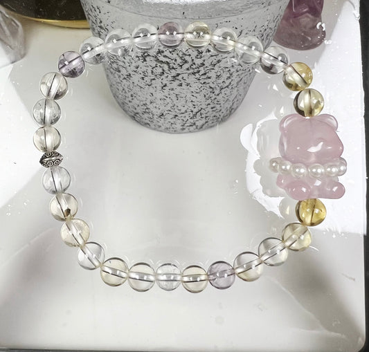 four-season crystal with bear-shaped rose quartz and sterling silver accessories bracelet.